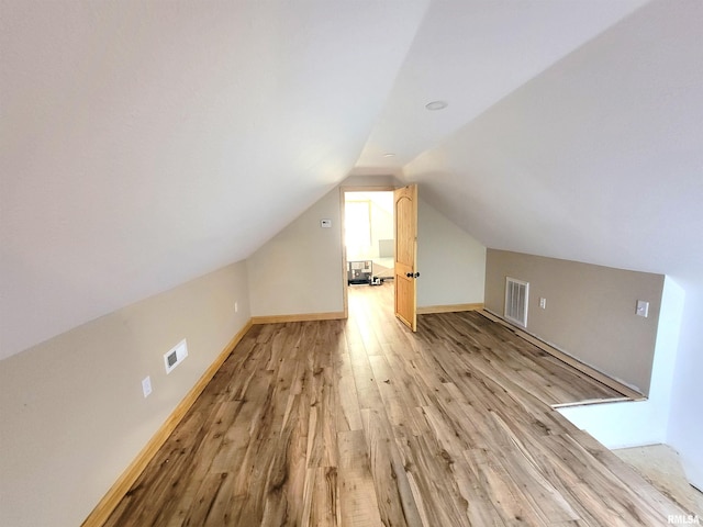 7324 State Route 161st Ext, Iuka, IL 62849 - additional living space featuring light wood-style floors, vaulted ceiling, and baseboards