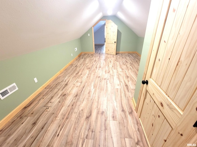 7324 State Route 161st Ext, Iuka, IL 62849 - additional living space featuring wood finished floors, vaulted ceiling, and baseboards