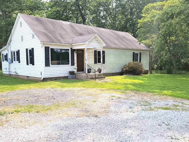 7324 State Route 161st Ext, Iuka, IL 62849 - ranch-style house with a front yard, roof with shingles, and view of scattered trees