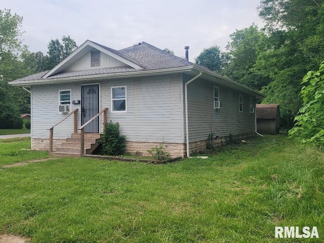 301 N Stotlar St, Benton, IL 62812 - view of front of house with entry steps, a front lawn, cooling unit, and a shingled roof