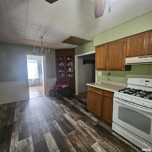 111 Rufus, Mount Vernon, IL 62864 - kitchen featuring white gas stove, extractor fan, dark wood-style floors, a wainscoted wall, and brown cabinetry