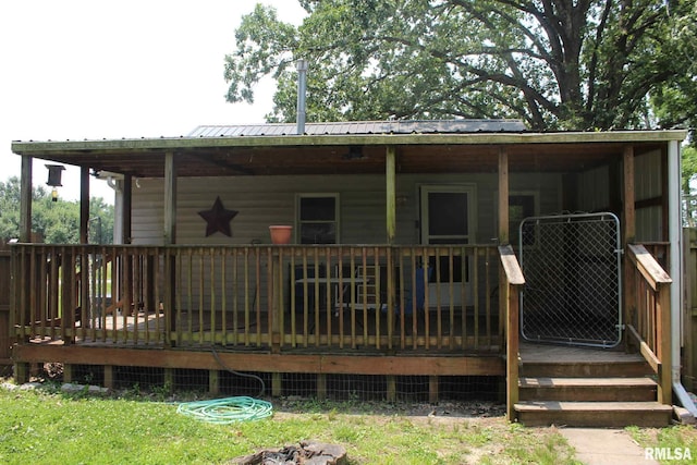 111 Rufus, Mount Vernon, IL 62864 - rear view of house featuring a wooden deck and metal roof