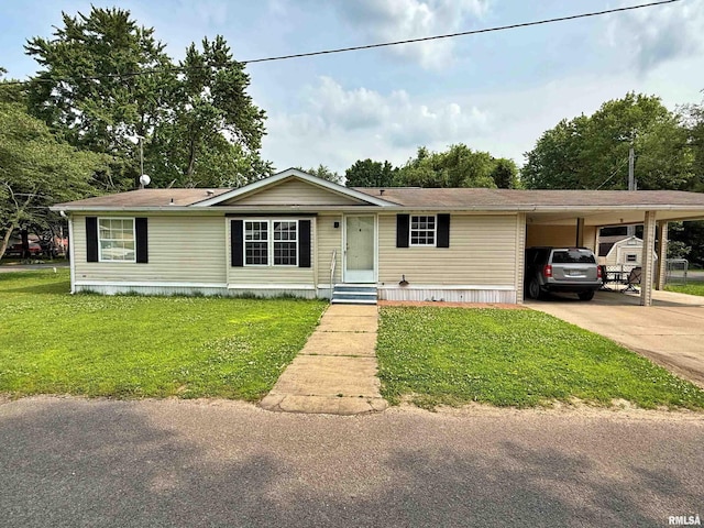 2000 Simmons St, Metropolis, IL 62960 - manufactured / mobile home with a front lawn, concrete driveway, a carport, and entry steps