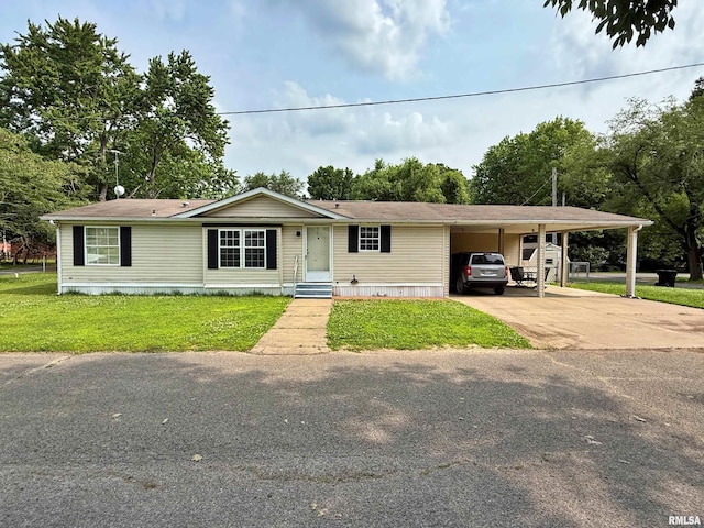 2000 Simmons St, Metropolis, IL 62960 - manufactured / mobile home with a front yard, concrete driveway, and an attached carport