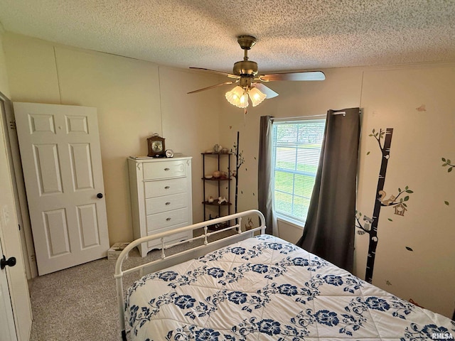 2000 Simmons St, Metropolis, IL 62960 - bedroom with carpet floors, a textured ceiling, and ceiling fan