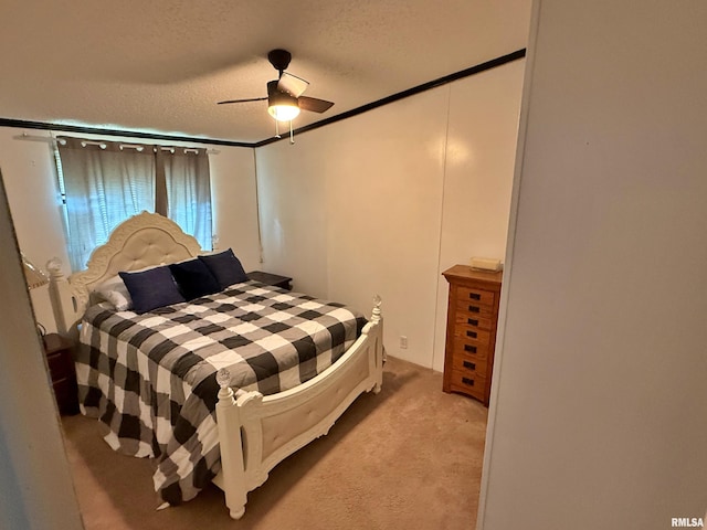 2000 Simmons St, Metropolis, IL 62960 - bedroom with light colored carpet, a textured ceiling, a ceiling fan, and ornamental molding