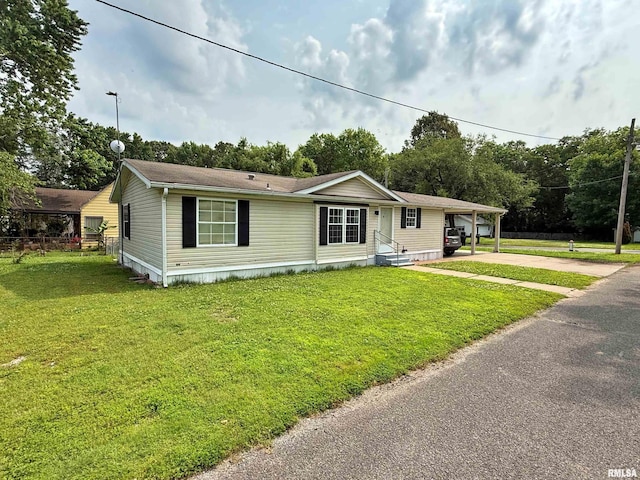 2000 Simmons St, Metropolis, IL 62960 - manufactured / mobile home featuring concrete driveway and a front lawn