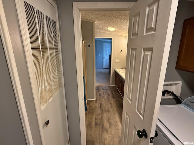 2000 Simmons St, Metropolis, IL 62960 - laundry area with a heating unit, a textured ceiling, dark wood finished floors, cabinet space, and independent washer and dryer