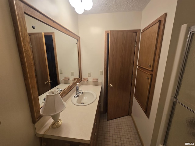 2998 Massac Creek Rd, Metropolis, IL 62960 - bathroom featuring vanity, a textured ceiling, and tile patterned floors