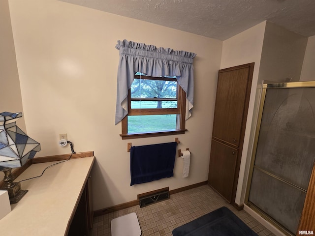 2998 Massac Creek Rd, Metropolis, IL 62960 - full bathroom featuring a stall shower and a textured ceiling