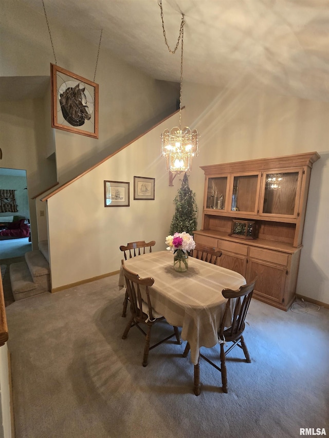 2998 Massac Creek Rd, Metropolis, IL 62960 - dining room featuring light carpet, a chandelier, and high vaulted ceiling