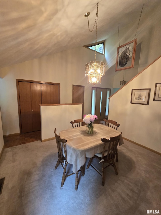 2998 Massac Creek Rd, Metropolis, IL 62960 - dining space with carpet, high vaulted ceiling, and a chandelier
