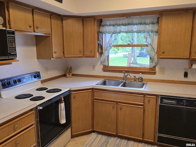 2998 Massac Creek Rd, Metropolis, IL 62960 - kitchen featuring white electric range, black dishwasher, light countertops, and brown cabinets