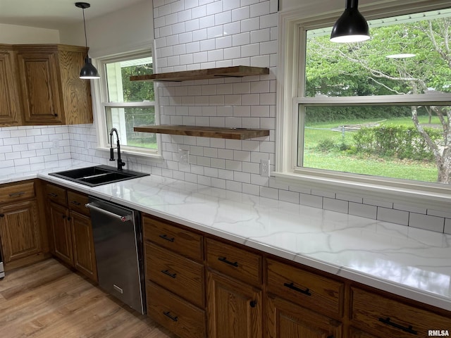 208 Dorris Dr, Metropolis, IL 62960 - kitchen featuring dishwasher, a sink, open shelves, brown cabinets, and tasteful backsplash