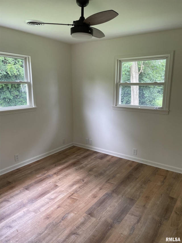 208 Dorris Dr, Metropolis, IL 62960 - spare room with ceiling fan, wood finished floors, and baseboards