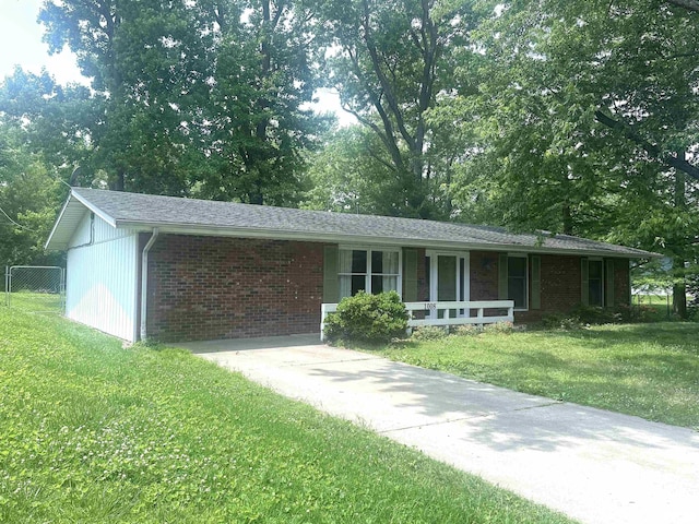 1008 N Norwest Ln, Carbondale, IL 62901 - ranch-style home with covered porch, brick siding, and view of scattered trees