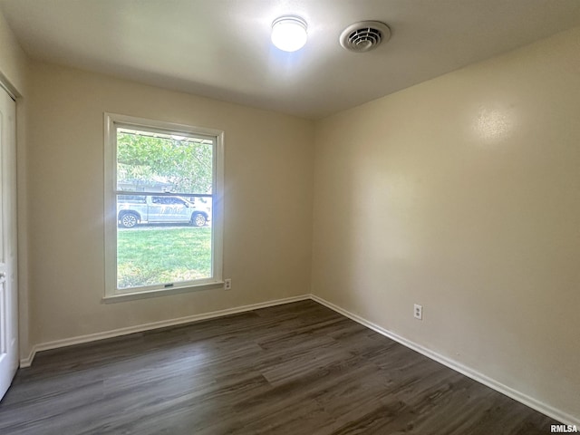 1008 N Norwest Ln, Carbondale, IL 62901 - spare room featuring dark wood-style flooring and baseboards