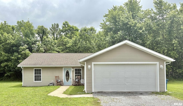 112 Townhouse Dr, Carterville, IL 62918 - ranch-style home featuring a front lawn, a shingled roof, and gravel driveway