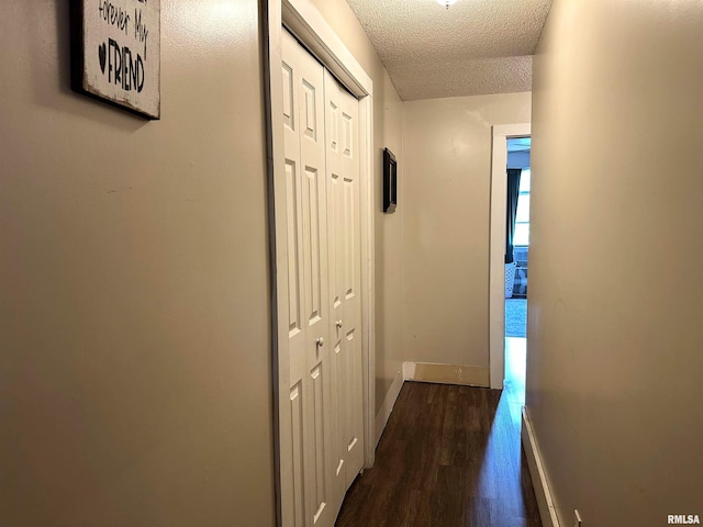 211 E Cross St, Dongola, IL 62926 - hallway featuring dark wood-style flooring, baseboards, and a textured ceiling