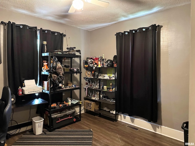 211 E Cross St, Dongola, IL 62926 - office area with a textured ceiling, wood finished floors, ceiling fan, and baseboards