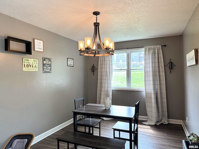 211 E Cross St, Dongola, IL 62926 - dining area featuring a chandelier, dark wood-style floors, a textured ceiling, and baseboards