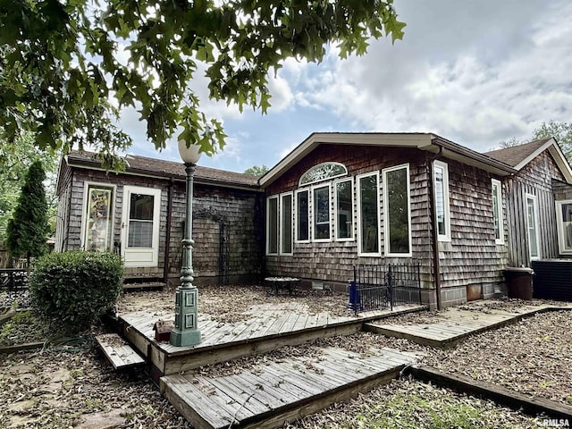 2016 Greenview St, Metropolis, IL 62960 - back of property with a wooden deck and central AC unit