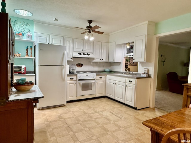 2016 Greenview St, Metropolis, IL 62960 - kitchen with white appliances, under cabinet range hood, ceiling fan, white cabinetry, and crown molding