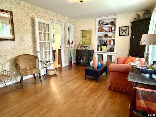 2016 Greenview St, Metropolis, IL 62960 - sitting room featuring wallpapered walls and wood finished floors
