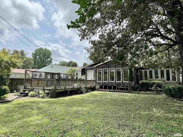 2016 Greenview St, Metropolis, IL 62960 - view of green lawn featuring a wooden deck and a sunroom