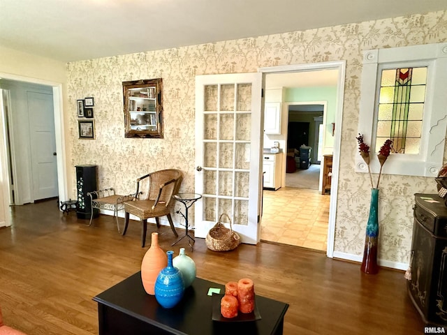 2016 Greenview St, Metropolis, IL 62960 - living area with wallpapered walls, wood finished floors, and baseboards