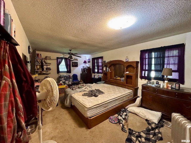 2601 Nielson Crossing Rd, Marion, IL 62959 - bedroom with a textured ceiling, carpet flooring, and radiator