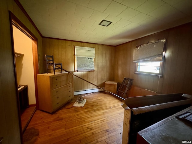 2601 Nielson Crossing Rd, Marion, IL 62959 - bedroom featuring baseboard heating, wood-type flooring, wood walls, and crown molding