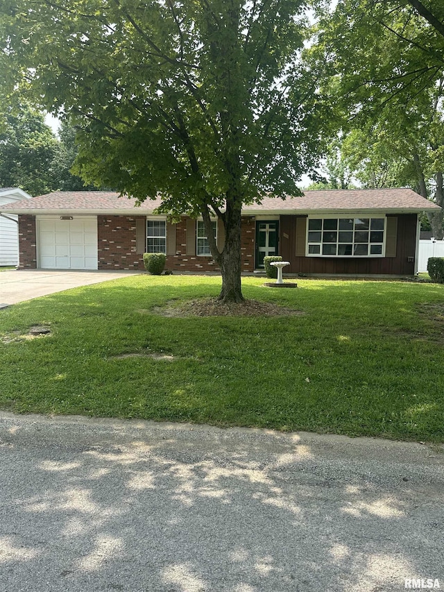 705 Terrace Dr, Duquoin, IL 62832 - ranch-style house with concrete driveway, a garage, a front lawn, and brick siding