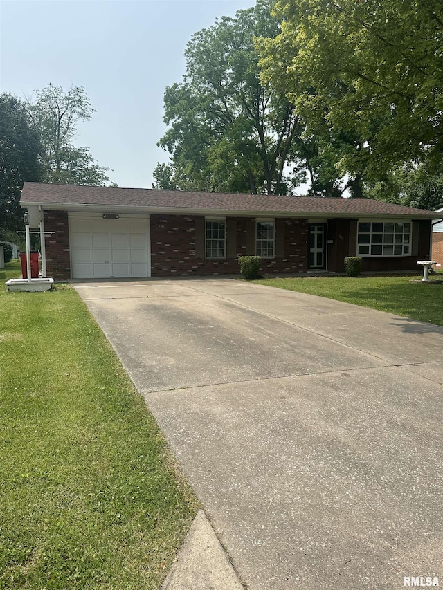 705 Terrace Dr, Duquoin, IL 62832 - single story home featuring concrete driveway, an attached garage, a front yard, and brick siding