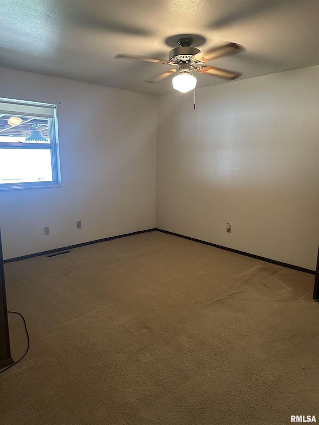 705 Terrace Dr, Duquoin, IL 62832 - unfurnished room with a ceiling fan, light carpet, and baseboards