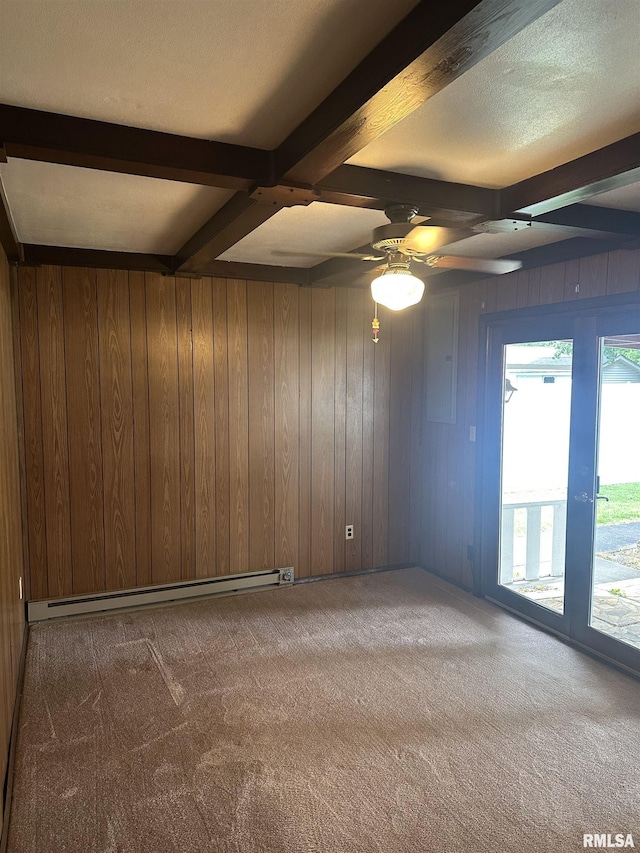 705 Terrace Dr, Duquoin, IL 62832 - empty room with baseboard heating, carpet, beam ceiling, a ceiling fan, and wood walls
