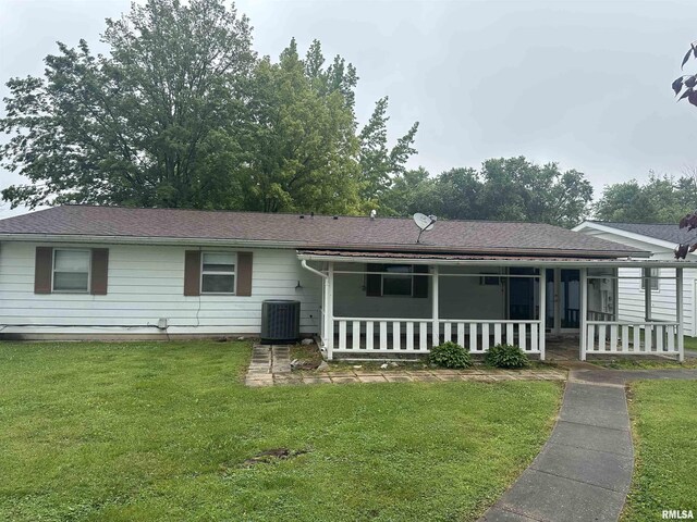 705 Terrace Dr, Duquoin, IL 62832 - single story home featuring central AC, a front yard, covered porch, and a shingled roof