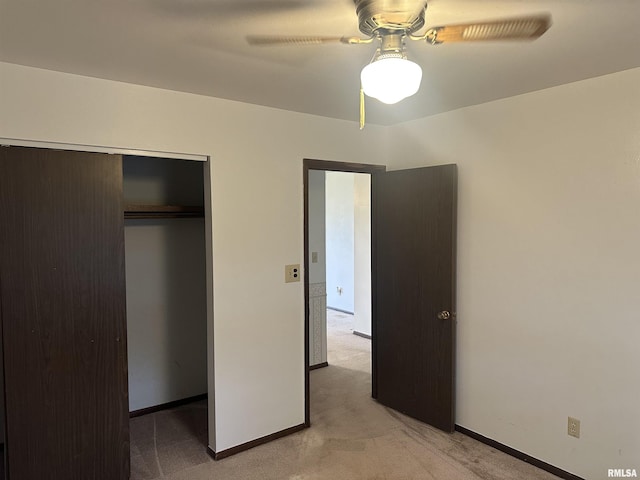 705 Terrace Dr, Duquoin, IL 62832 - unfurnished bedroom with light colored carpet, a closet, baseboards, and a ceiling fan