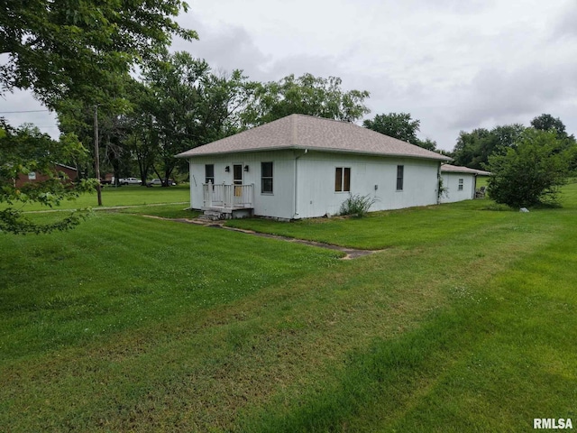 11218 Old Lake Rd, Benton, IL 62812 - rear view of property featuring a lawn and roof with shingles