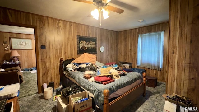 11218 Old Lake Rd, Benton, IL 62812 - carpeted bedroom with wood walls and ceiling fan
