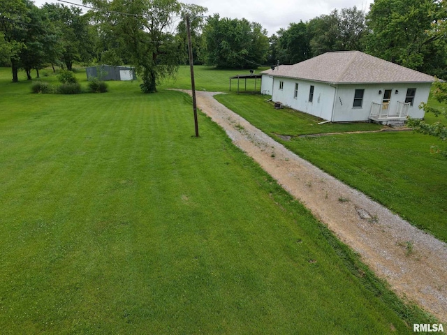 11218 Old Lake Rd, Benton, IL 62812 - view of green lawn with driveway and view of scattered trees