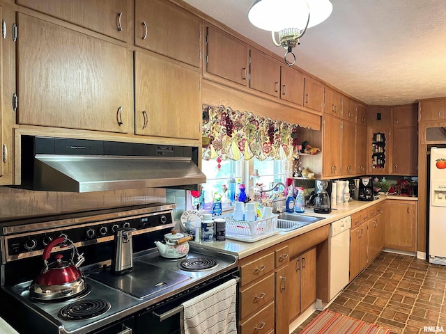 1011 W Goodall St, Marion, IL 62959 - kitchen featuring white appliances, under cabinet range hood, brick patterned flooring, light countertops, and brown cabinets