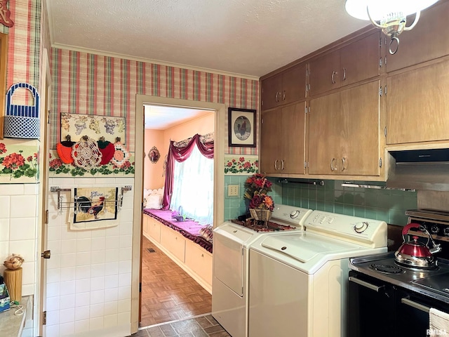 1011 W Goodall St, Marion, IL 62959 - laundry room featuring wallpapered walls, washing machine and dryer, crown molding, a wainscoted wall, and tile walls