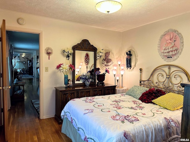 1011 W Goodall St, Marion, IL 62959 - bedroom with wood-type flooring, ornamental molding, and a textured ceiling