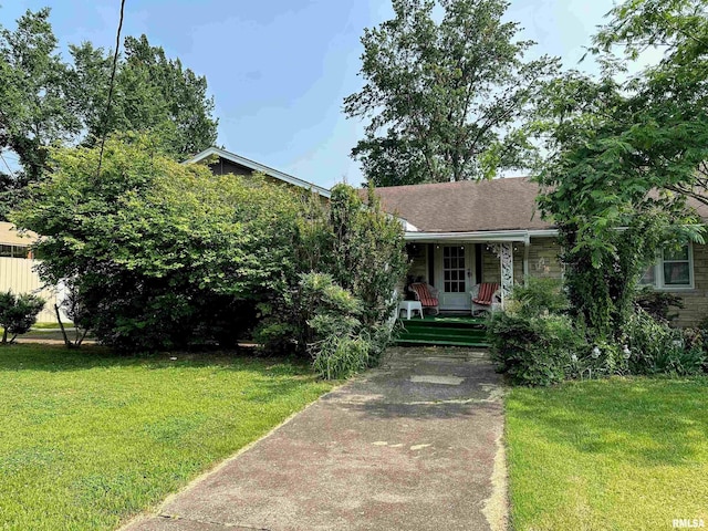 1011 W Goodall St, Marion, IL 62959 - obstructed view of property with a porch, a front lawn, and stone siding