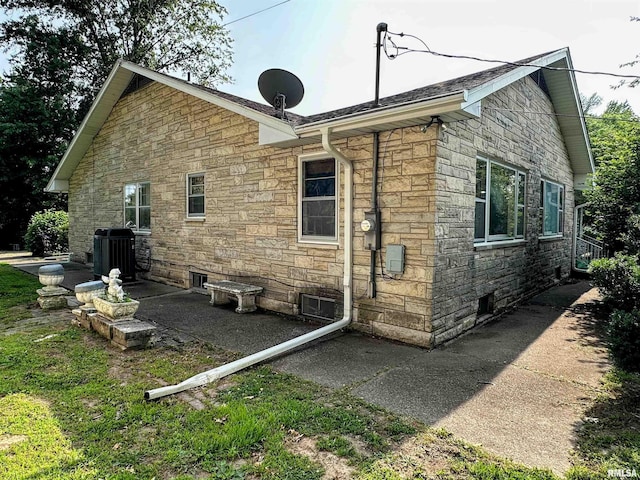 1011 W Goodall St, Marion, IL 62959 - back of property featuring stone siding and central air condition unit