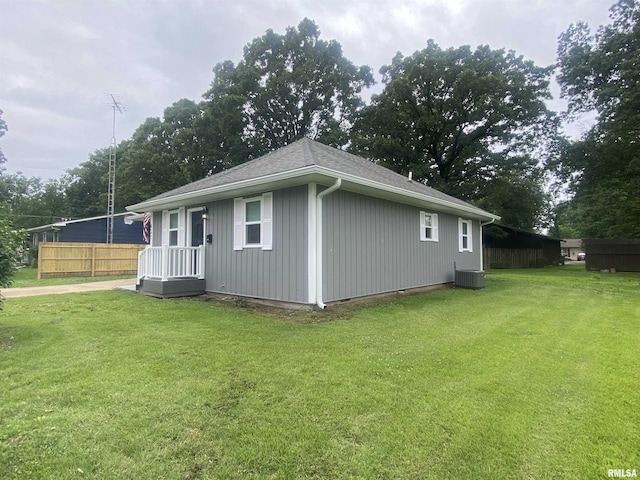 421 N 10th St, Benton, IL 62812 - view of home's exterior with central AC unit and a shingled roof