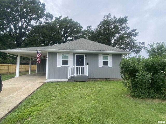 421 N 10th St, Benton, IL 62812 - bungalow featuring an attached carport, driveway, and roof with shingles