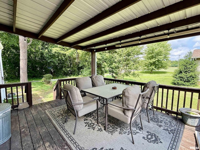113 E 21st St, Metropolis, IL 62960 - wooden deck with outdoor dining area, a yard, and view of wooded area