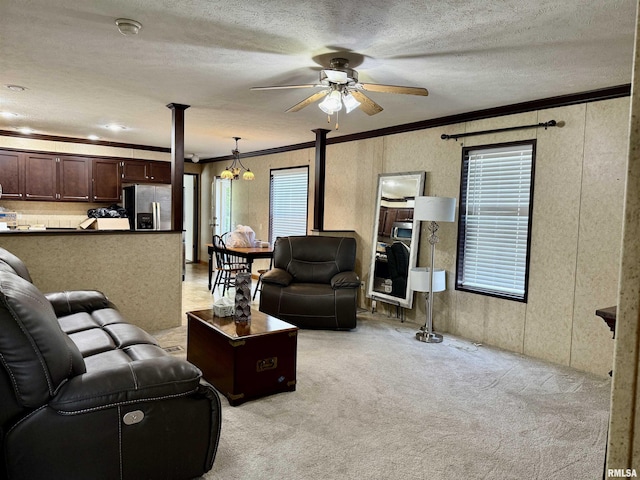 113 E 21st St, Metropolis, IL 62960 - living room with ornamental molding, a ceiling fan, light colored carpet, and a textured ceiling